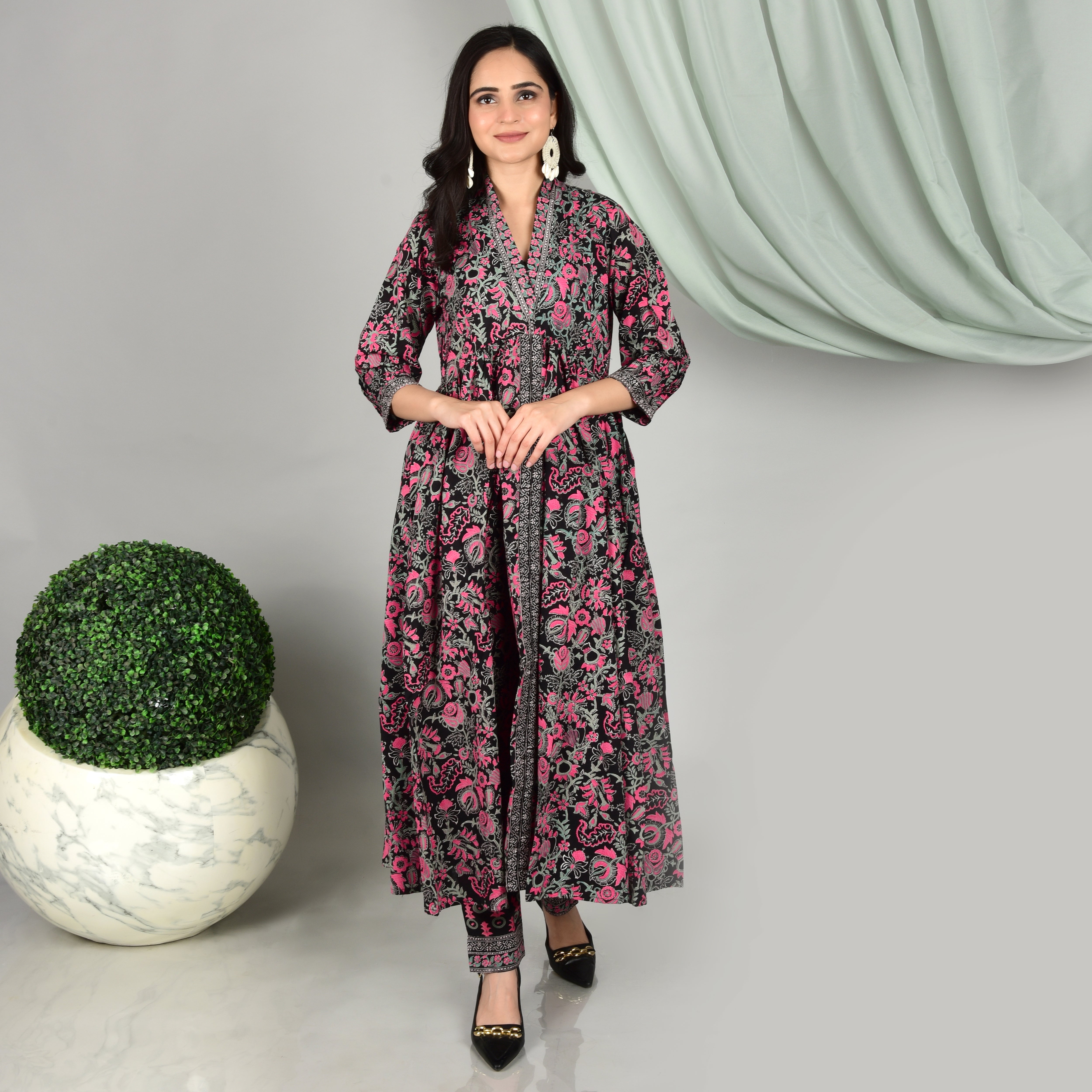 A Black maxi dress adorned with a mesmerizing floral jaal in vibrant Magenta. - printsutra